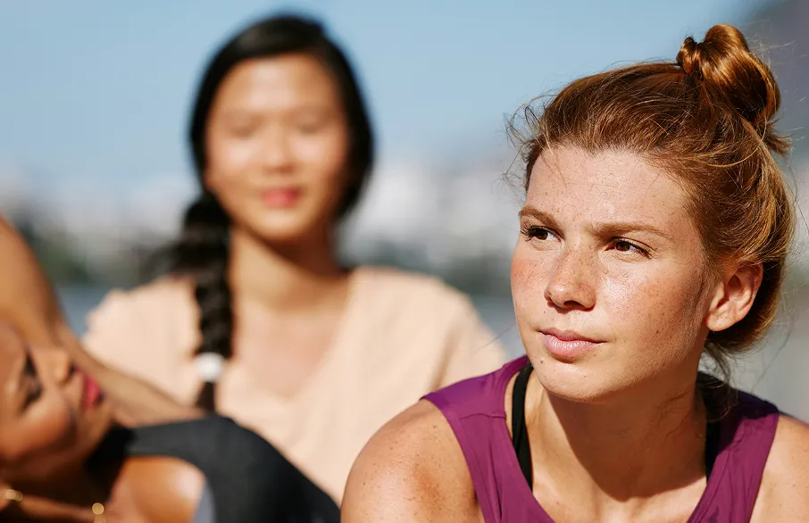 People practicing yoga outdoors