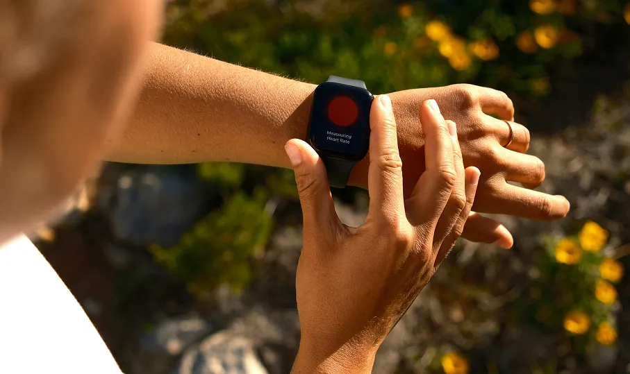 Person by fence looking thoughtful